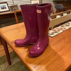 Hunter tall rain boots.